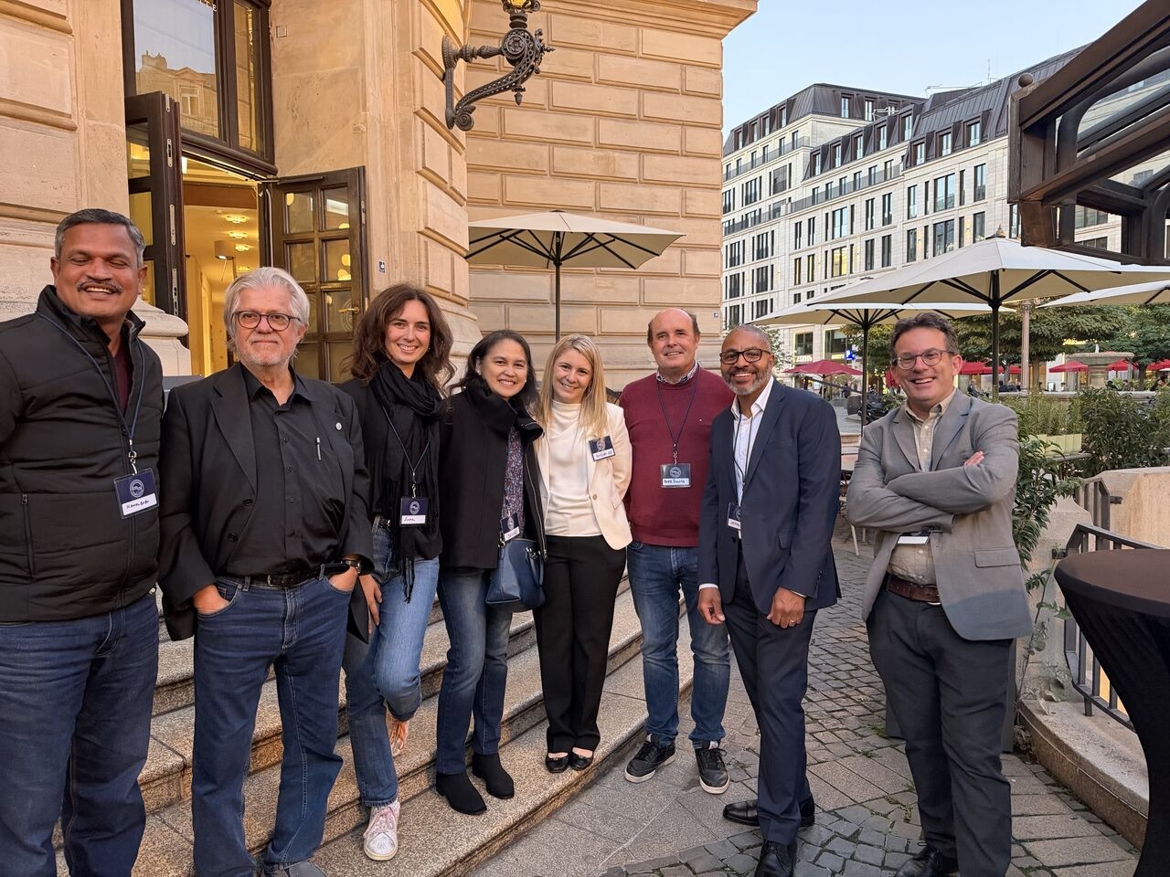 Eight people from Bentham Science Publishers, 4Evolution, University of Toronto Press and XSci standing together outside a building at the Frankfurt Book Fair.